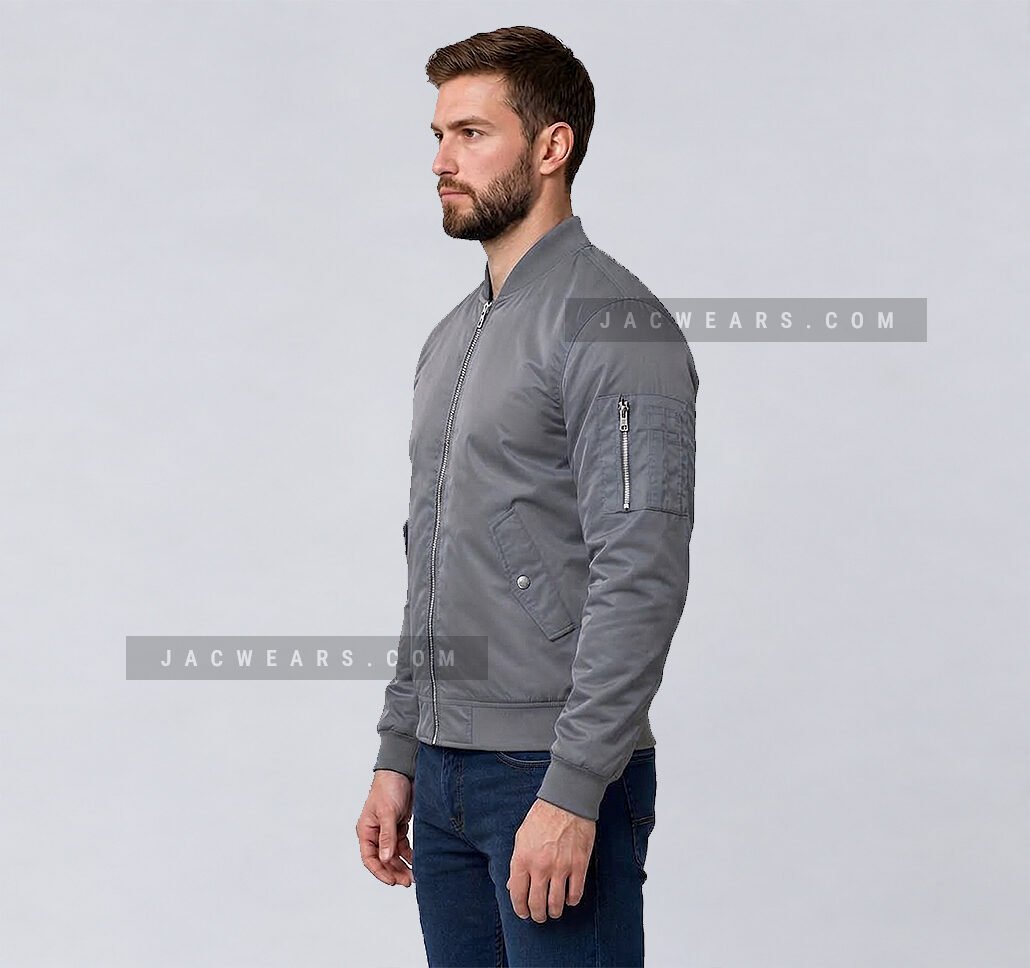 Custom grey nylon bomber jacket with utility sleeve pocket, side view