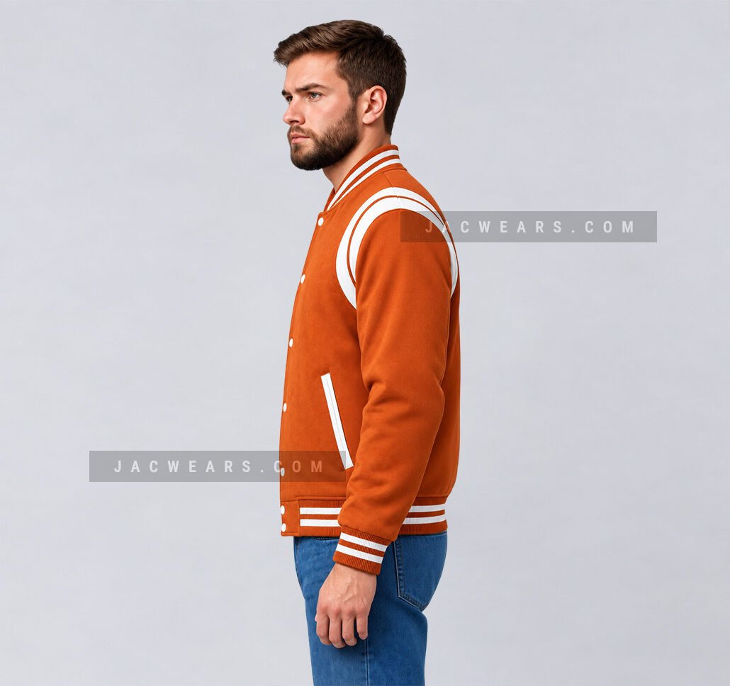 Custom orange wool letterman jacket with white shoulder inserts, side view