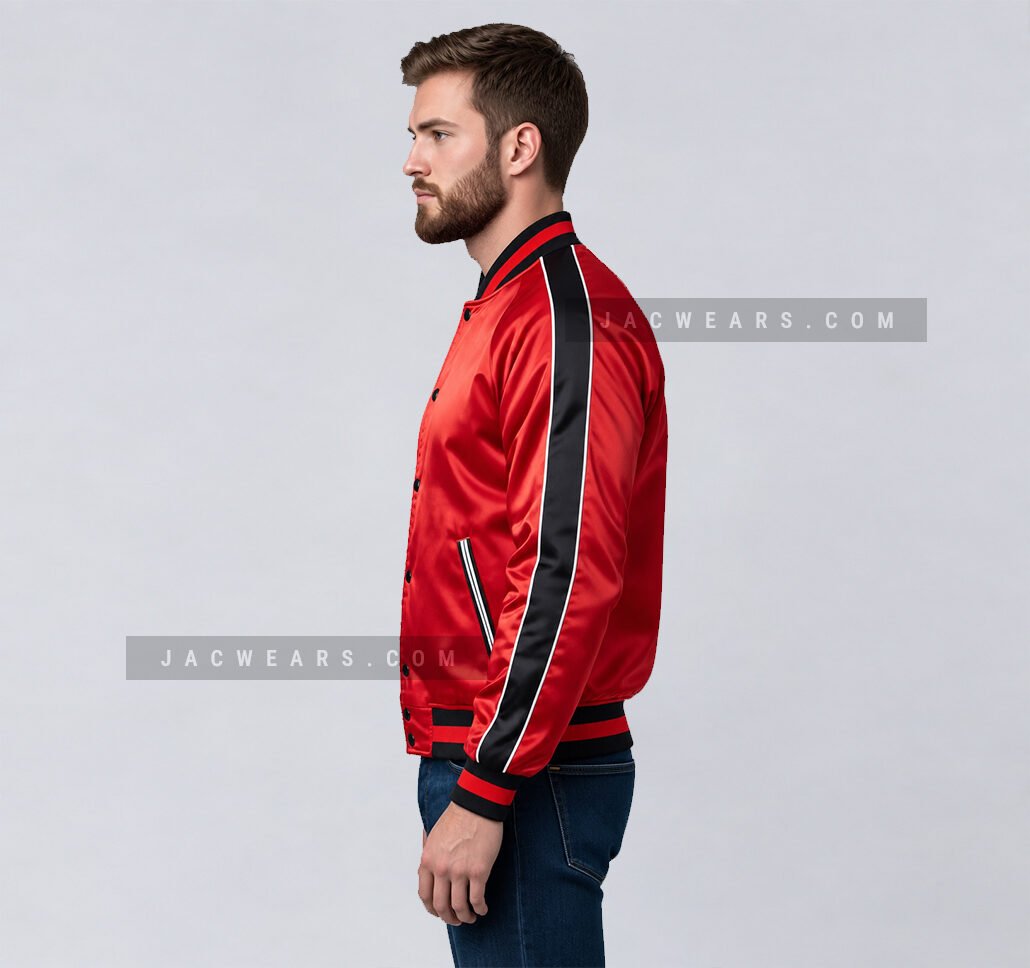 Custom red satin varsity jacket with black side stripes, side view