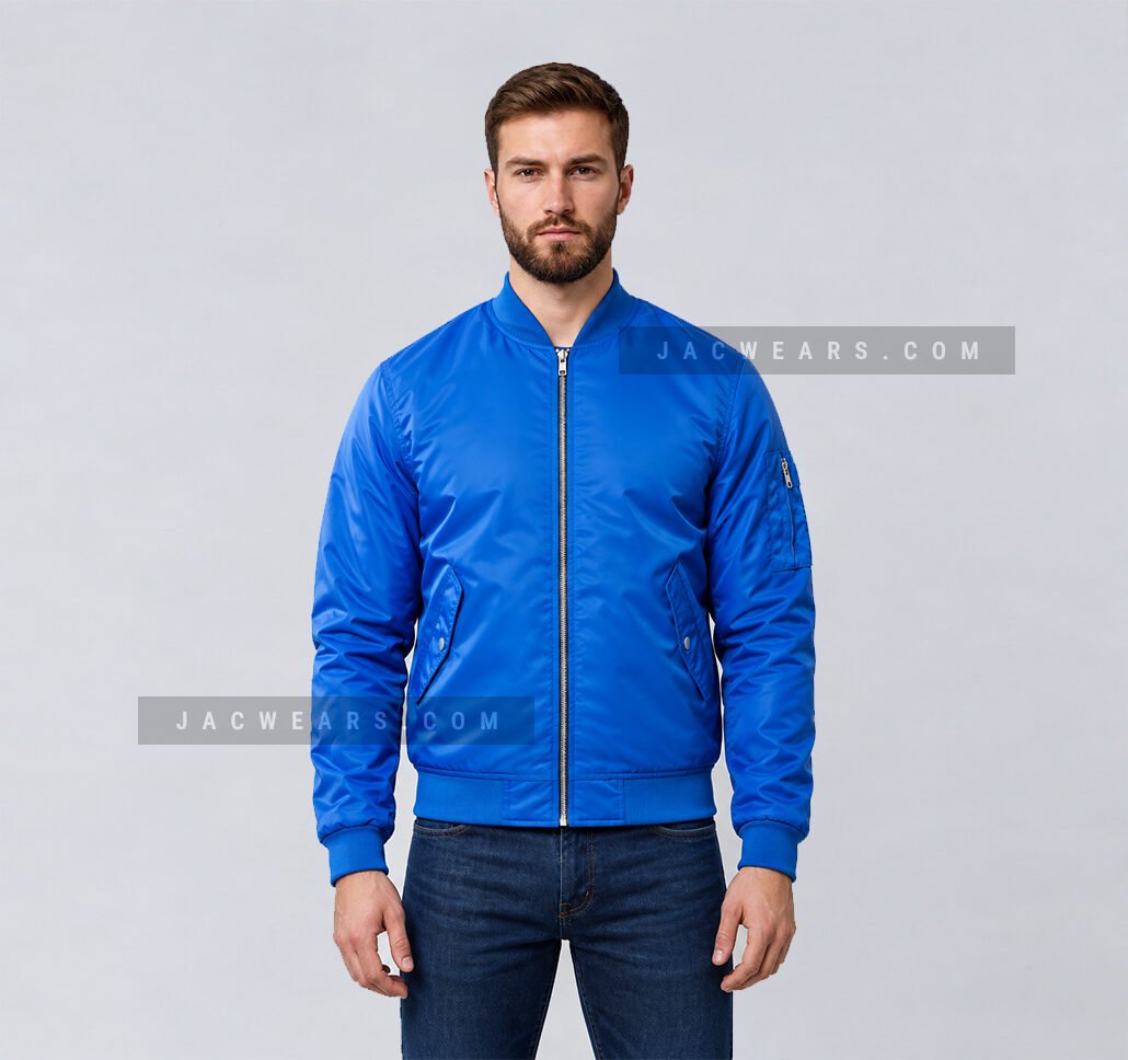 Custom royal blue nylon bomber jacket with utility sleeve pocket, front detail view