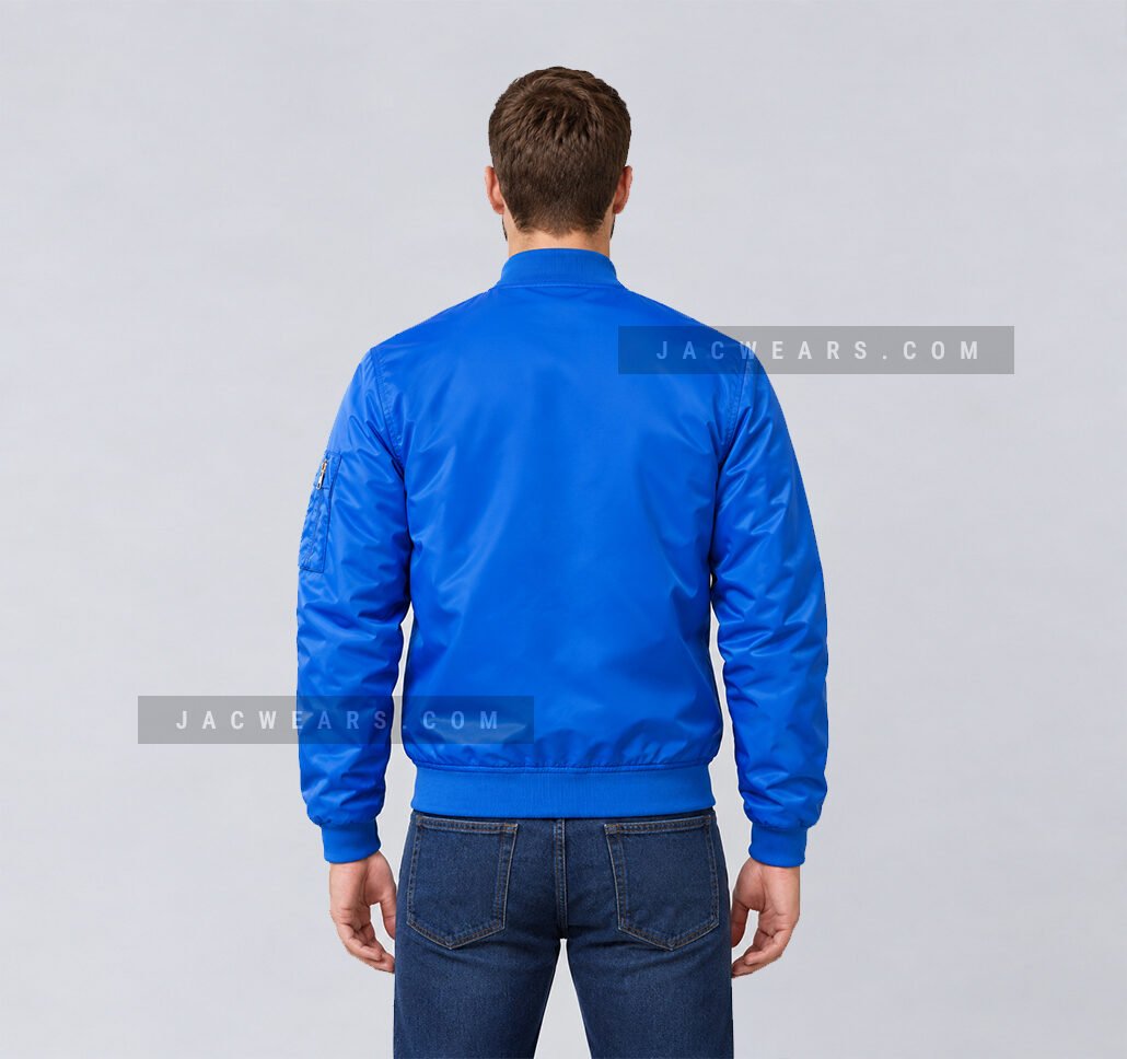 Custom royal blue nylon bomber jacket with utility sleeve pocket, back view