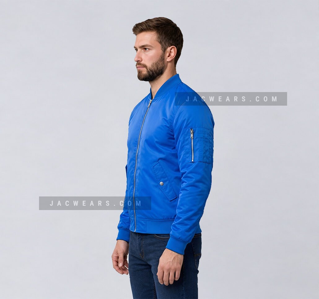 Custom royal blue nylon bomber jacket with utility sleeve pocket, angled view