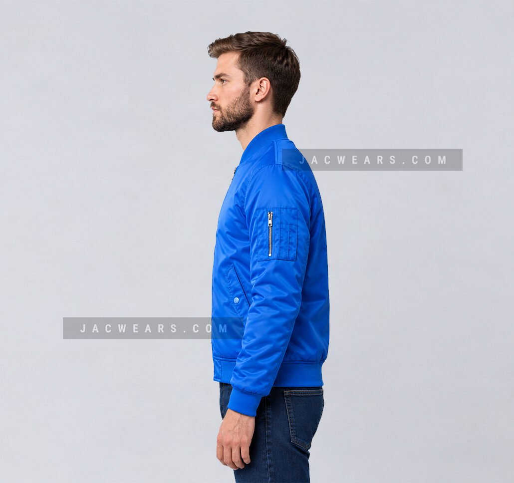 Custom royal blue nylon bomber jacket with utility sleeve pocket, side view