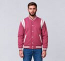 Custom pink wool letterman jacket with white shoulder inserts, front view